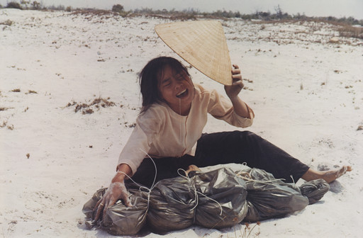 A Woman Mourning over the Bundled Remains of Her Husband