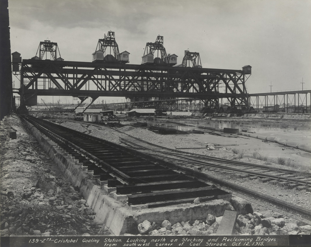 Cristobal coaling station. Looking north on sticking and reclaiming bridges from southwest corner of coal storage.