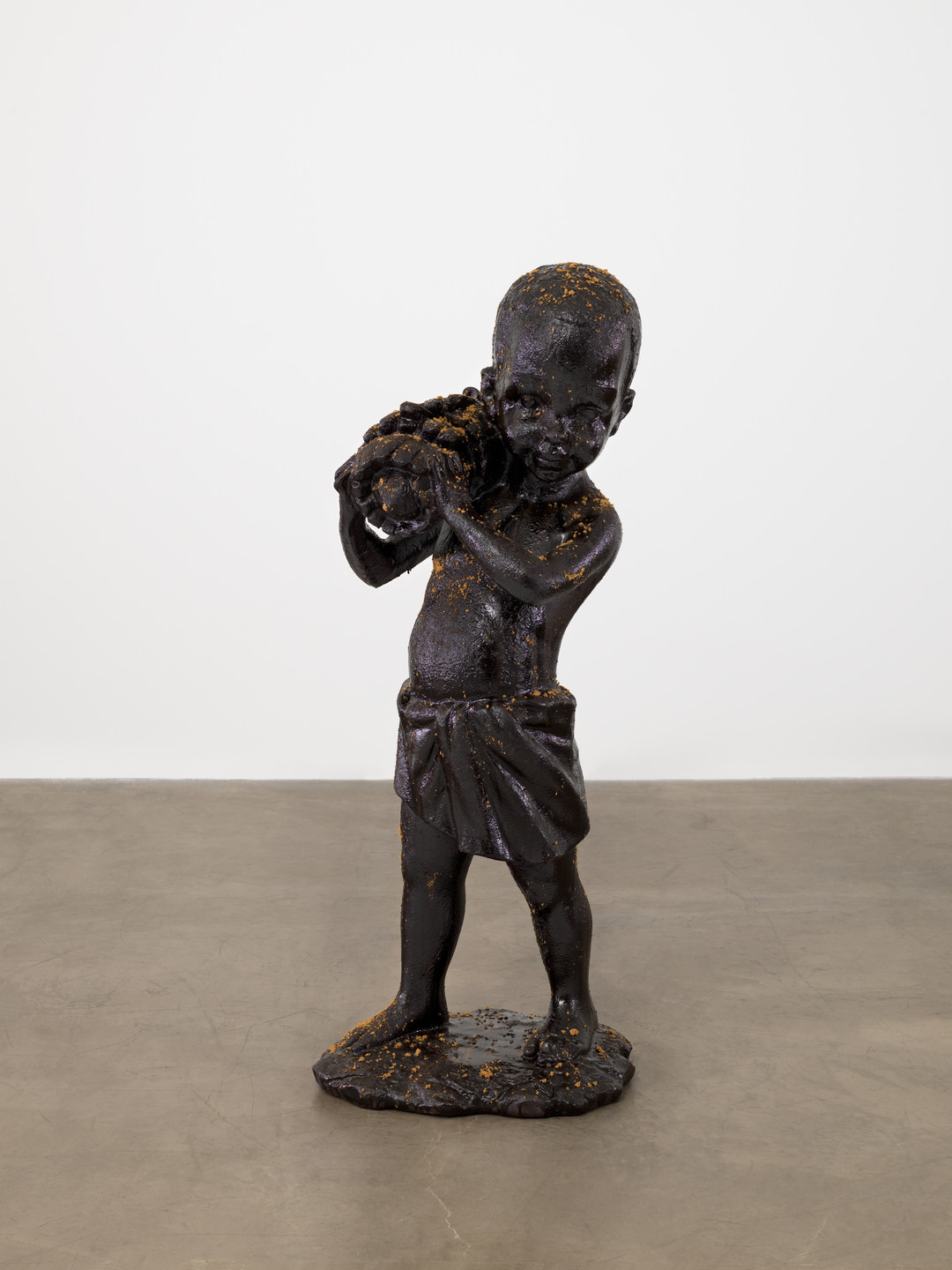 Kara Walker. African Boy Attendant Curio with Molasses and Brown Sugar, from "The Marvelous Sugar Baby" Installation at the old Domino Sugar Factory Warehouse (Bananas). 2014