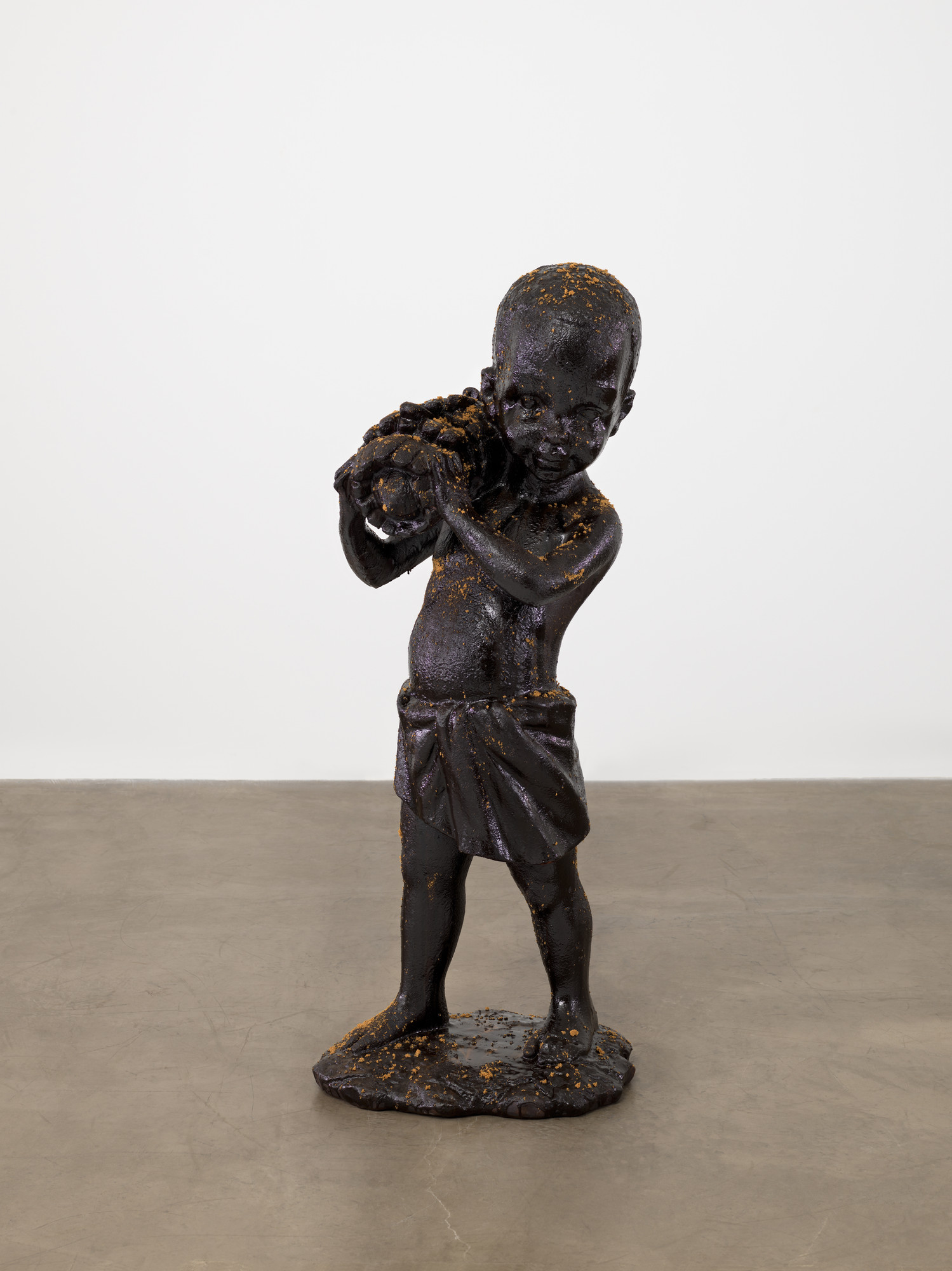 Kara Walker. African Boy Attendant Curio with Molasses and Brown Sugar, from "The Marvelous Sugar Baby" Installation at the old Domino Sugar Factory Warehouse (Bananas)