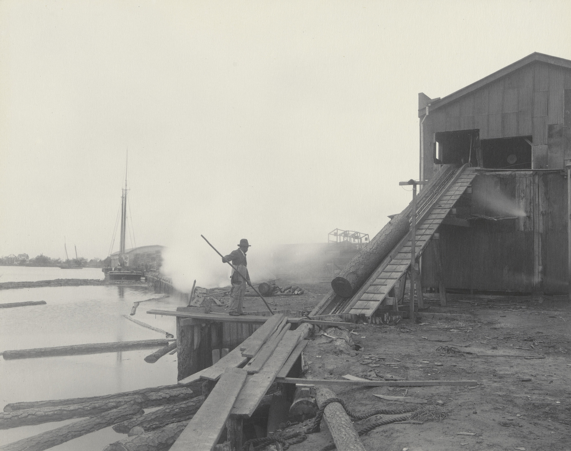 Frances Benjamin Johnston. The Saw Mill. From the raft to the saw