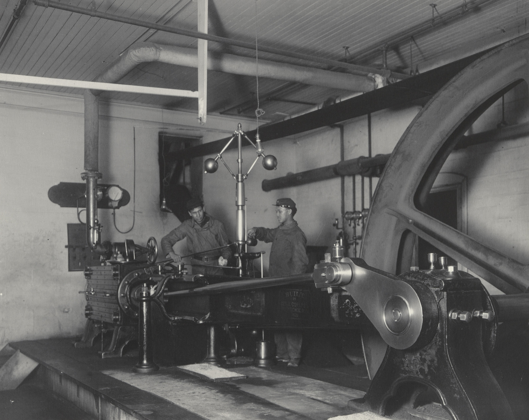 Frances Benjamin Johnston. In the engine room