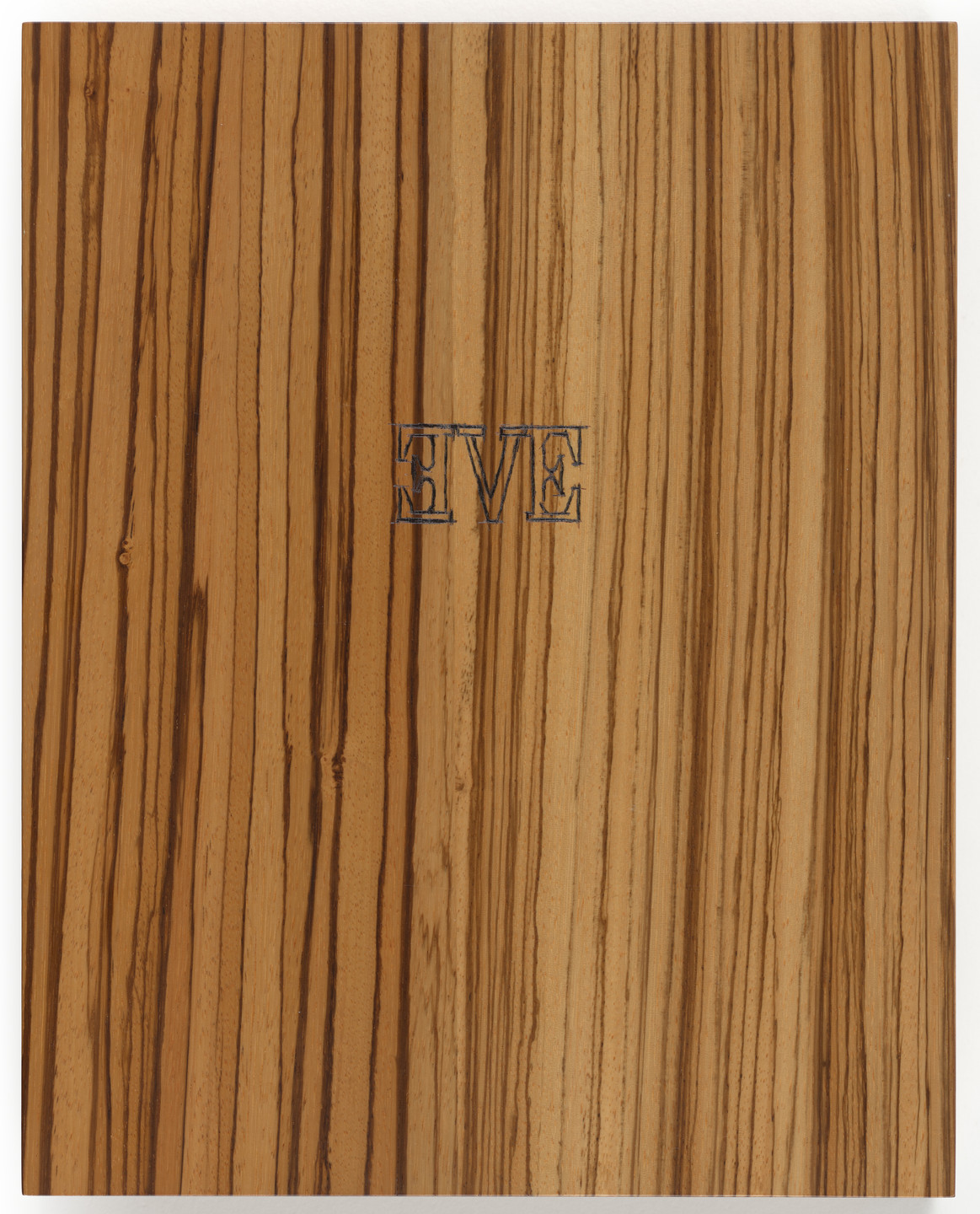 A wooden panel with vertical, natural brown and tan lines. The letters &#34;EVE&#34; are carved in the center in blue. This is an AI generated description. To give feedback, email ai@moma.org.