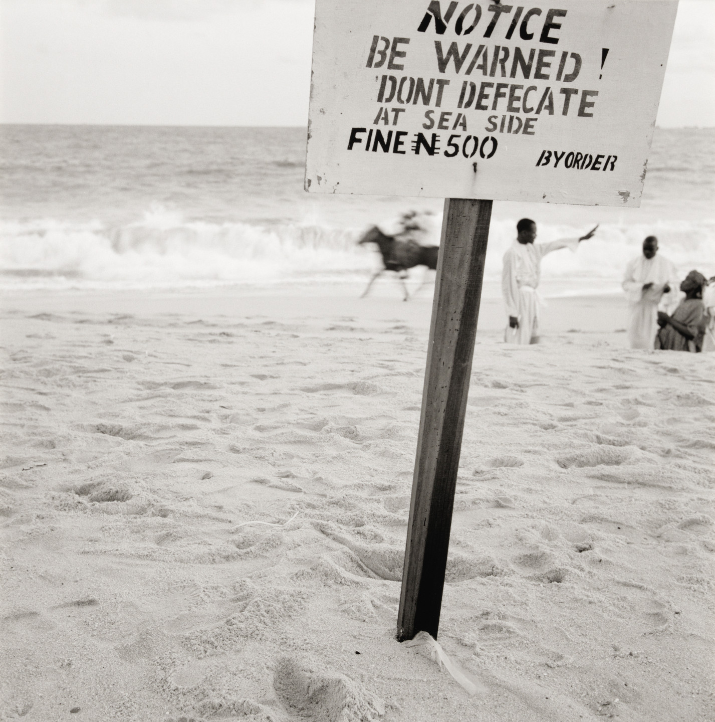 Akinbode Akinbiyi. Bar Beach, Victoria Island, Lagos from the series Sea Never Dry. 2004