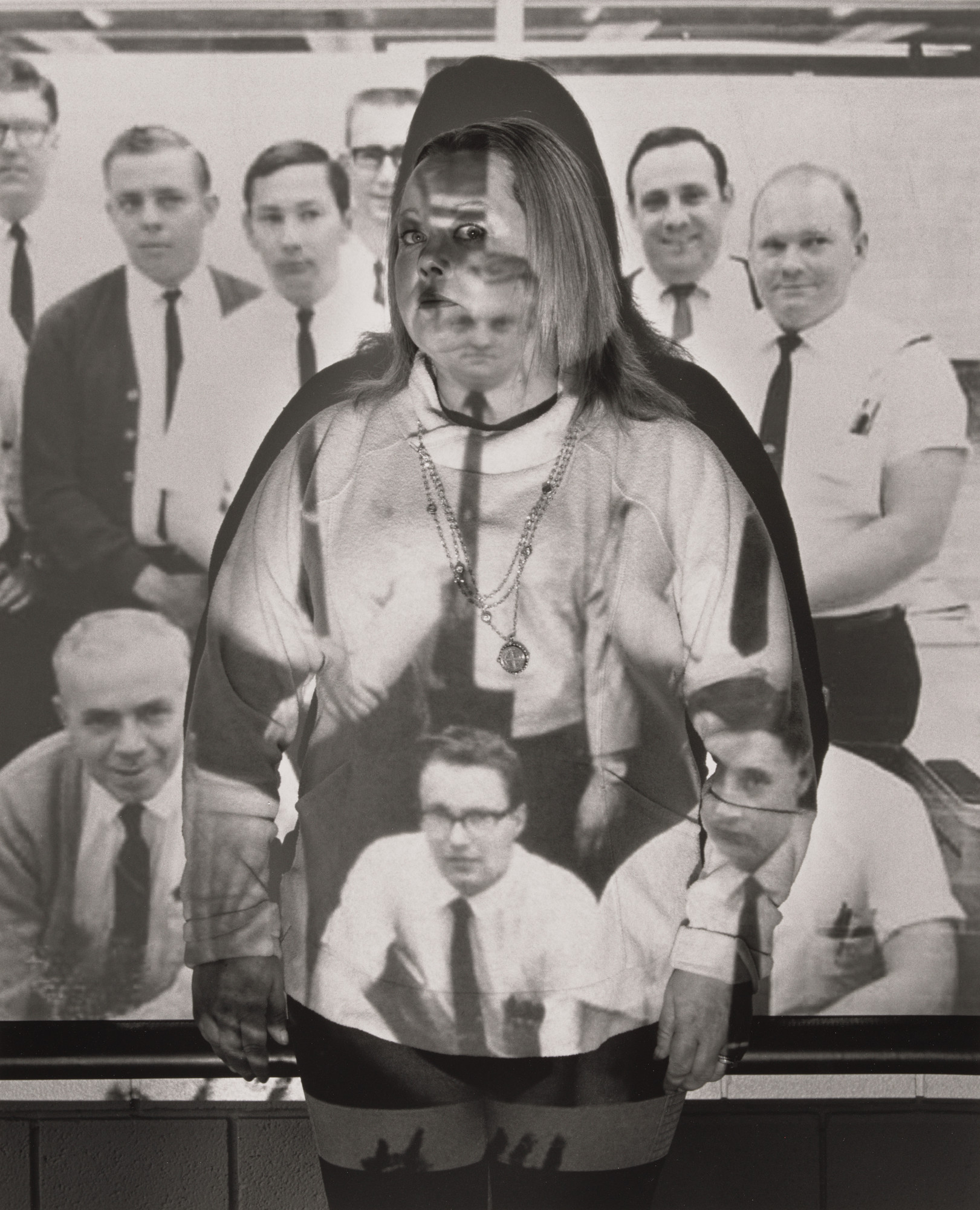 LaToya Ruby Frazier. Christina Defelice, UAW Local 1112, with a photograph of her father Jerry L. Canter and fellow scheduled clerks Frank Powers, Charles Steiner, Charles Walters, Al Basco, Jim Nichols, Mike Dobransky, and Rendal Stout, inside UAW Local 1112 Reuther Scandy Alli union hall, (Transition Center customer service representative, 11 years in at GM) Lordstown Complex trim shop), Lordstown, OH.