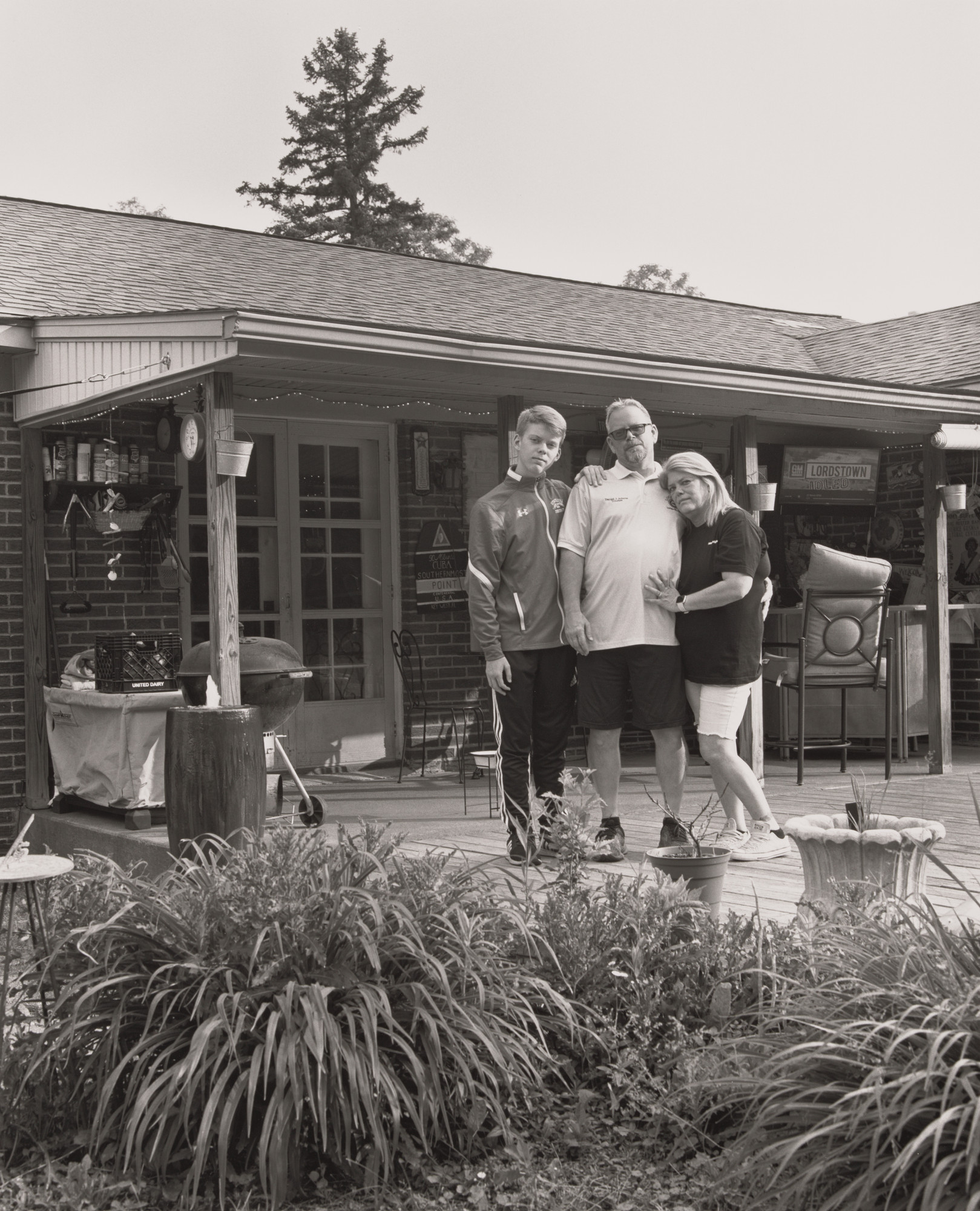 LaToya Ruby Frazier. Dan Adams, UAW Local 1112, Trustee, with his wife Patricia and his son Sean at home on their back deck, (24.7 years in at GM Lord-stown Complex, trim shop), Struthers, OH.