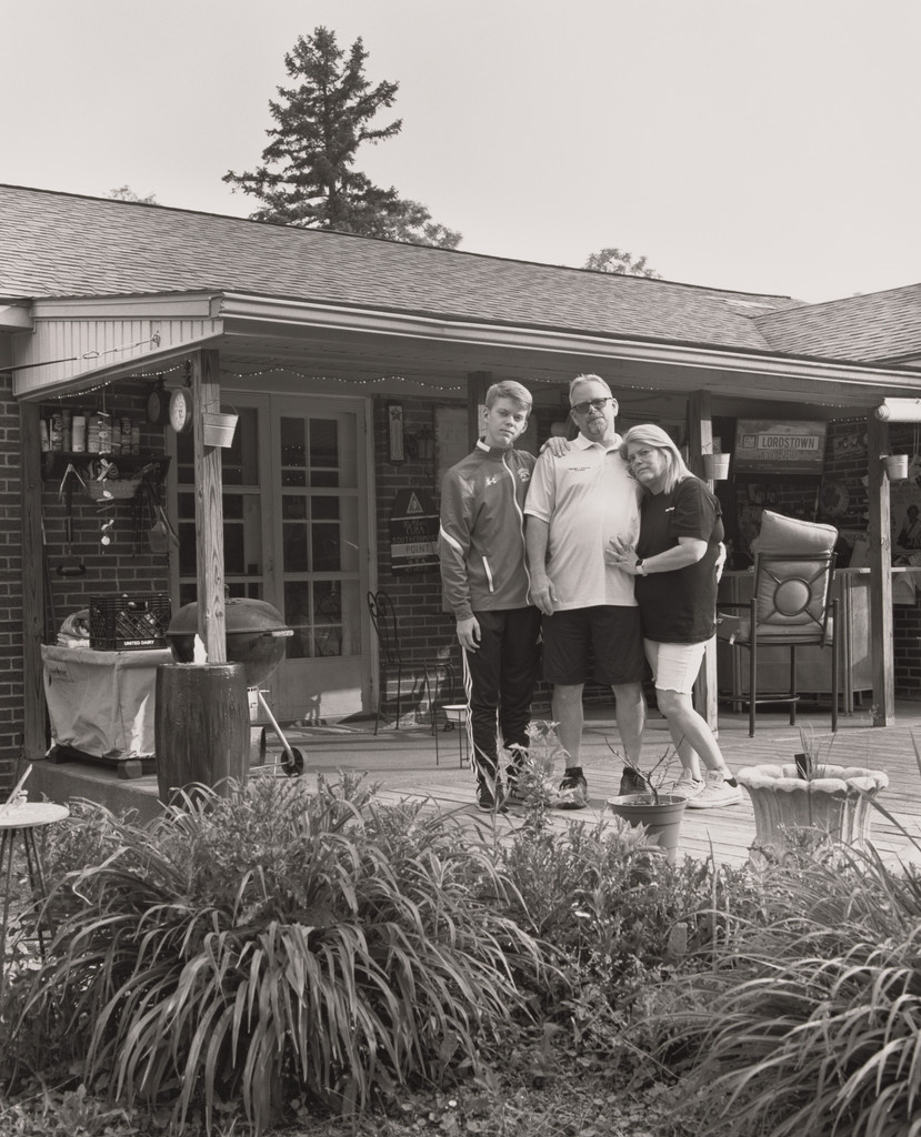 Dan Adams, UAW Local 1112, Trustee, with his wife Patricia and his son Sean at home on their back deck, (24.7 years in at GM Lord-stown Complex, trim shop), Struthers, OH.
