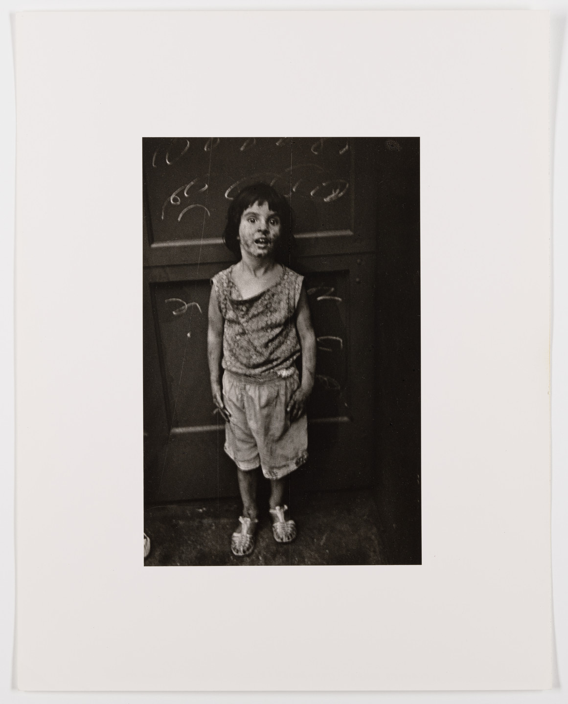 Diane Arbus. Child at night, scribbled wall, Greenwich St., N.Y.C. 1961. 1961