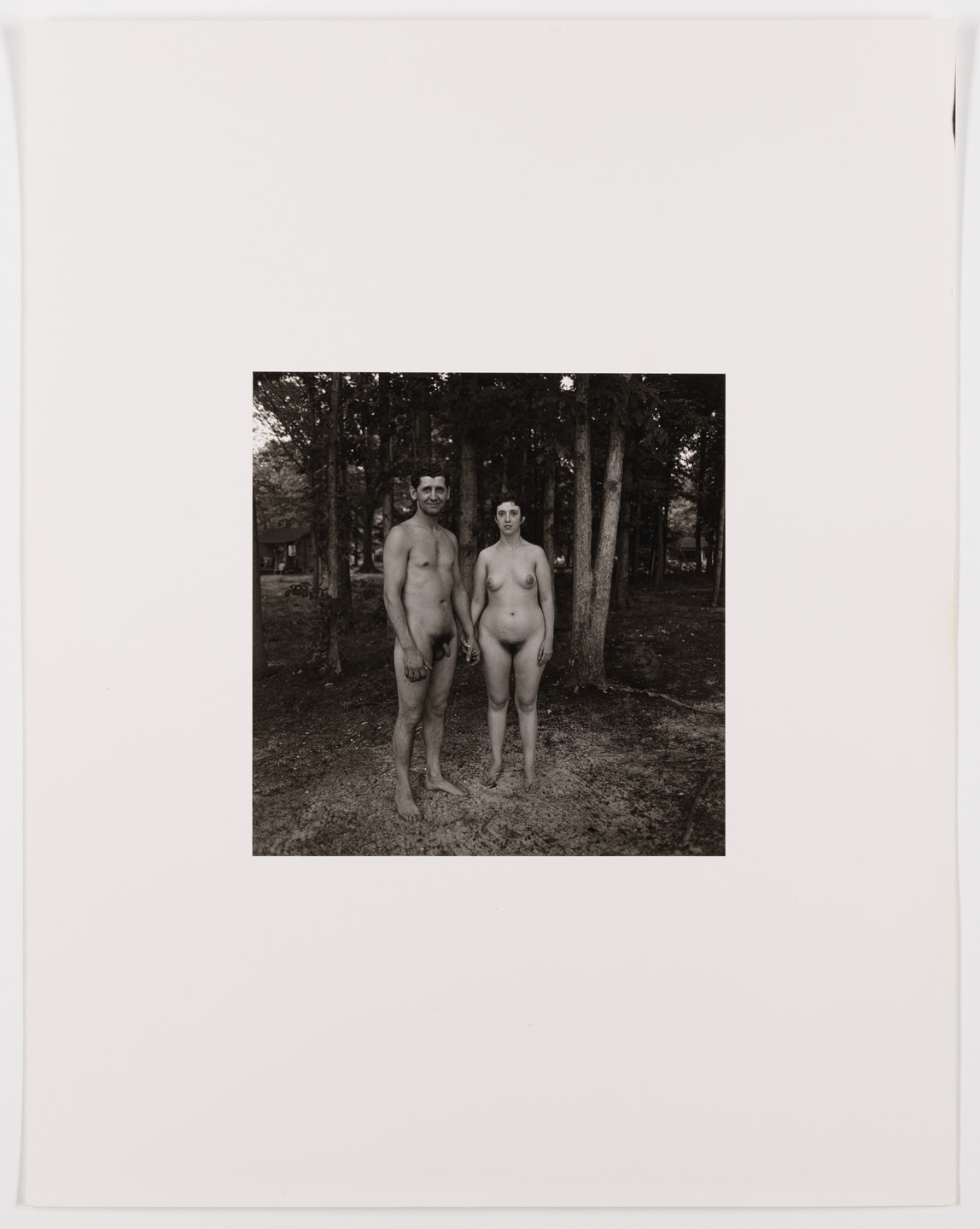 Diane Arbus. Man and wife in the woods, evening, nudist camp, N.J., 1963. 1963