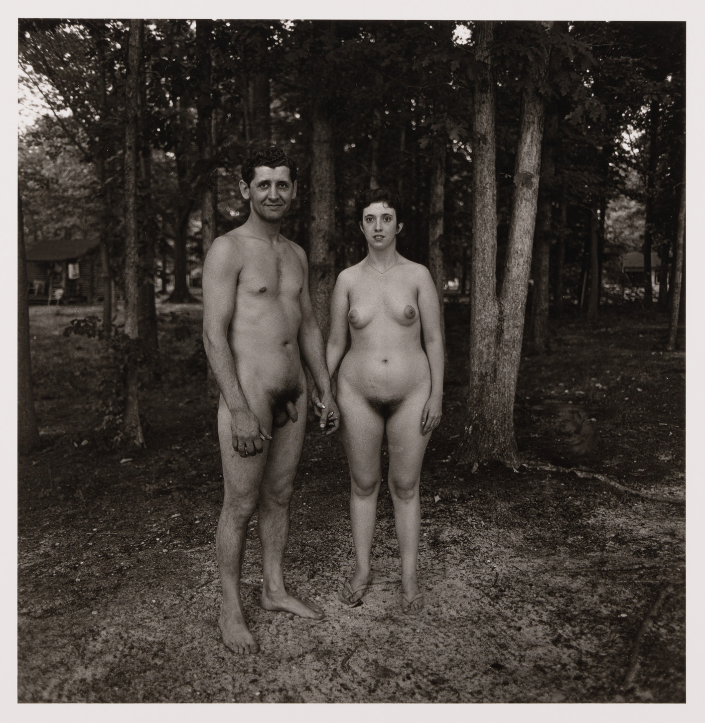 Diane Arbus. Man and wife in the woods, evening, nudist camp, N.J., 1963. 1963