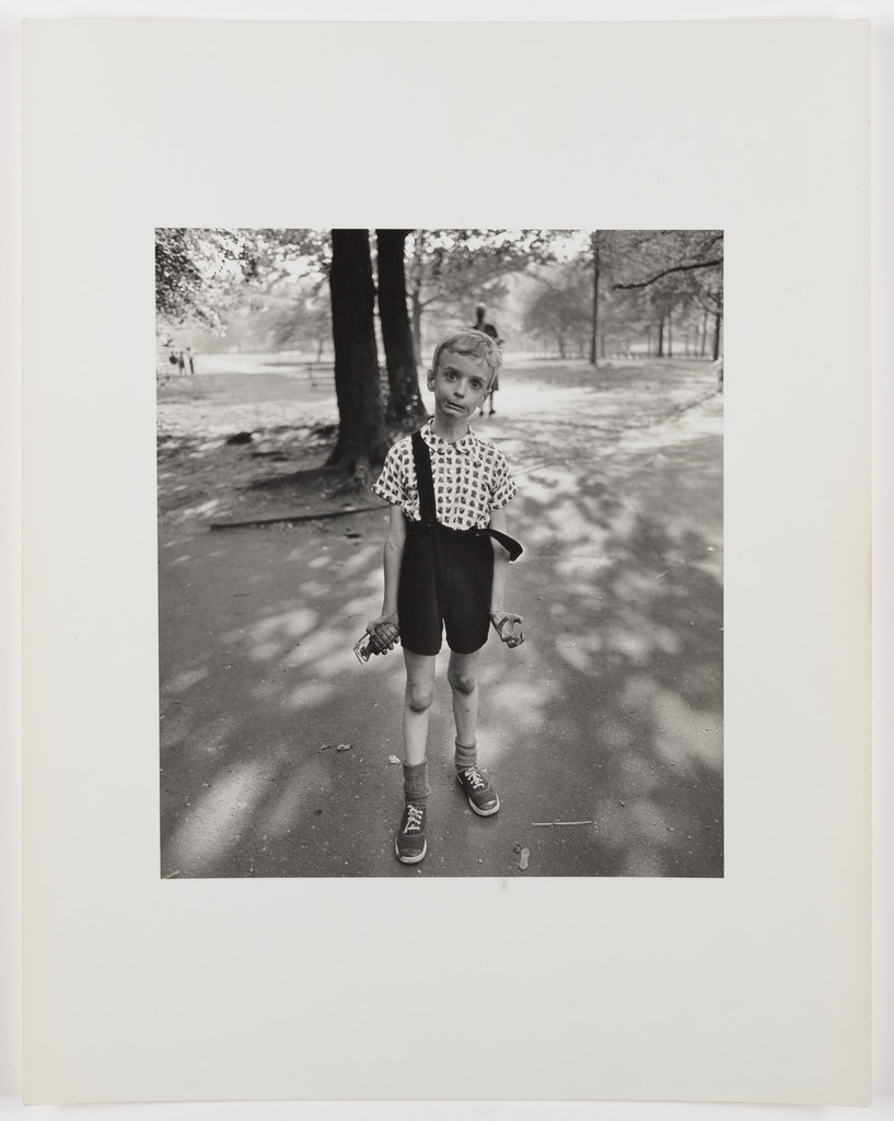 Child with a toy hand grenade in Central Park, N.Y.C., 1962