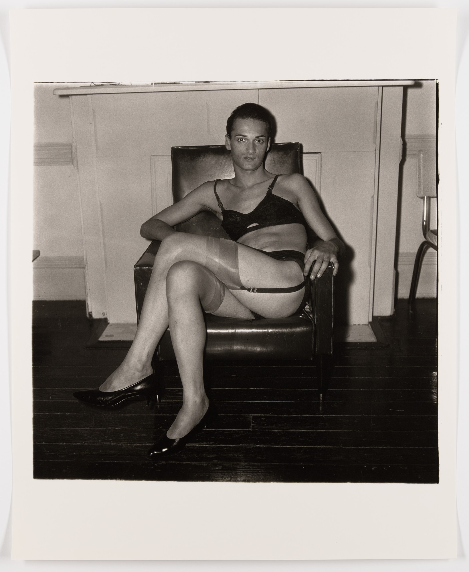 Diane Arbus. Seated man in a bra and stockings, N.Y.C., 1967