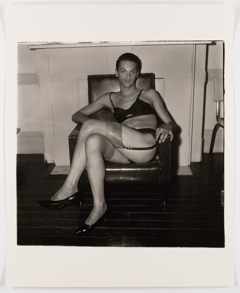 Seated man in a bra and stockings, N.Y.C., 1967