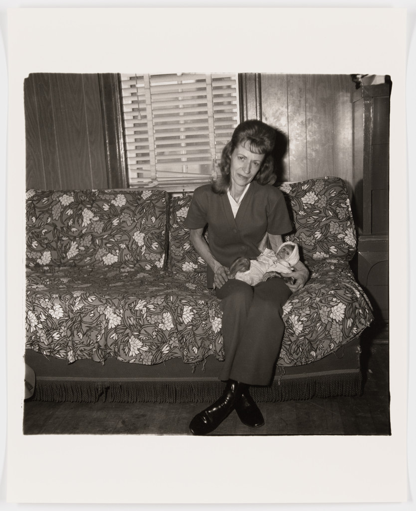 A woman with her baby monkey, N.J., 1971