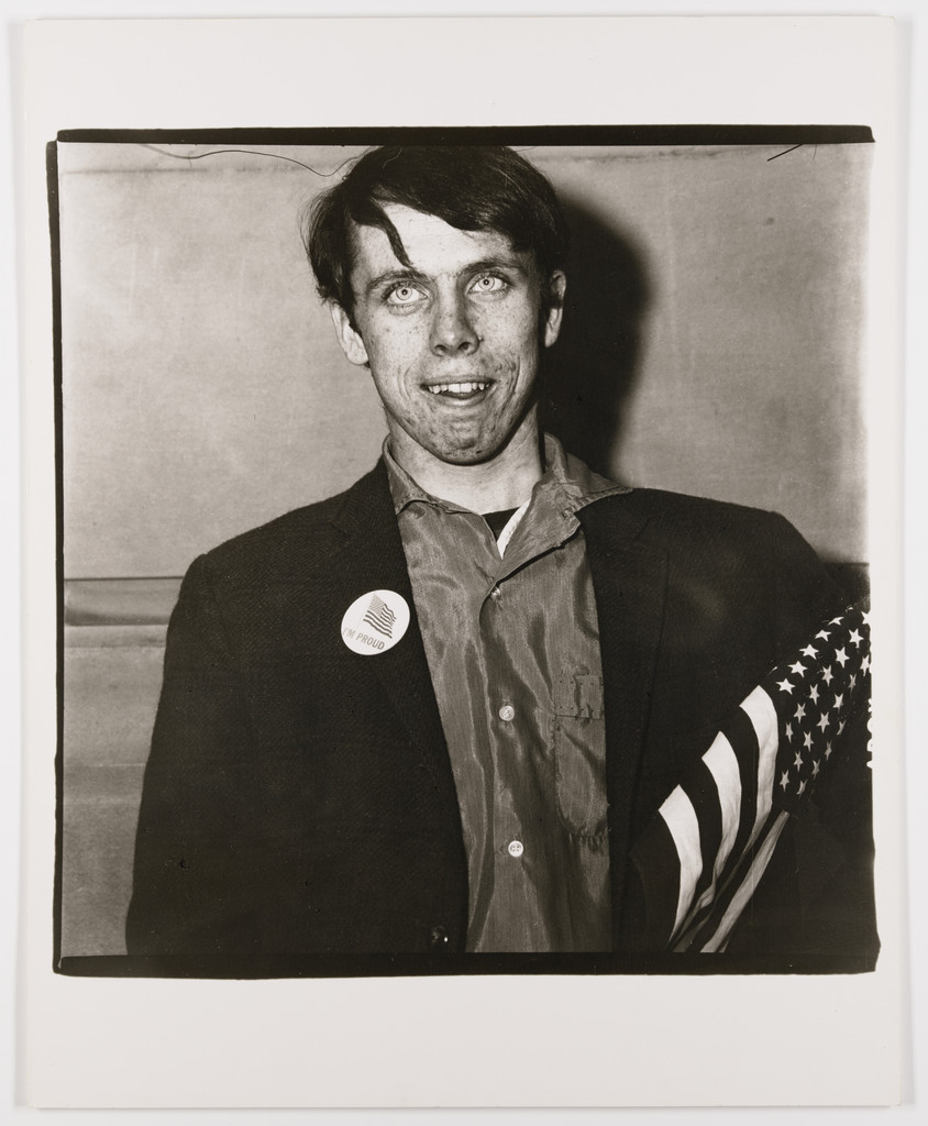Patriotic young man with a flag, N.Y.C., 1967