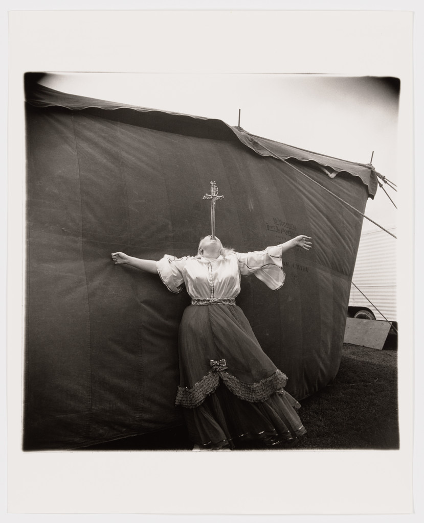 Albino sword swallower at a carnival, Maryland, 1970