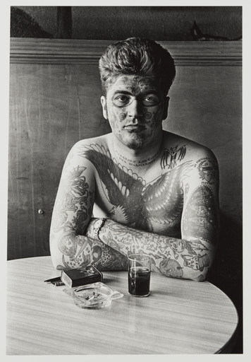 Diane Arbus. Jack Dracula at a bar, New London, Connecticut. 1961