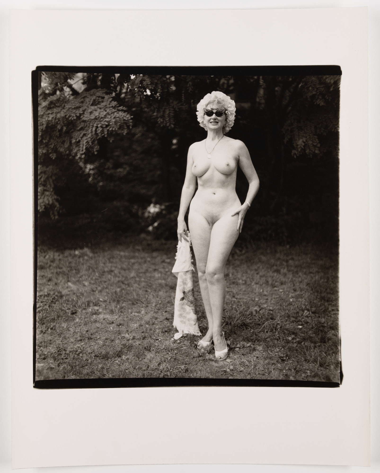 Diane Arbus. Nudist lady with swan sunglasses, P.A., 1965