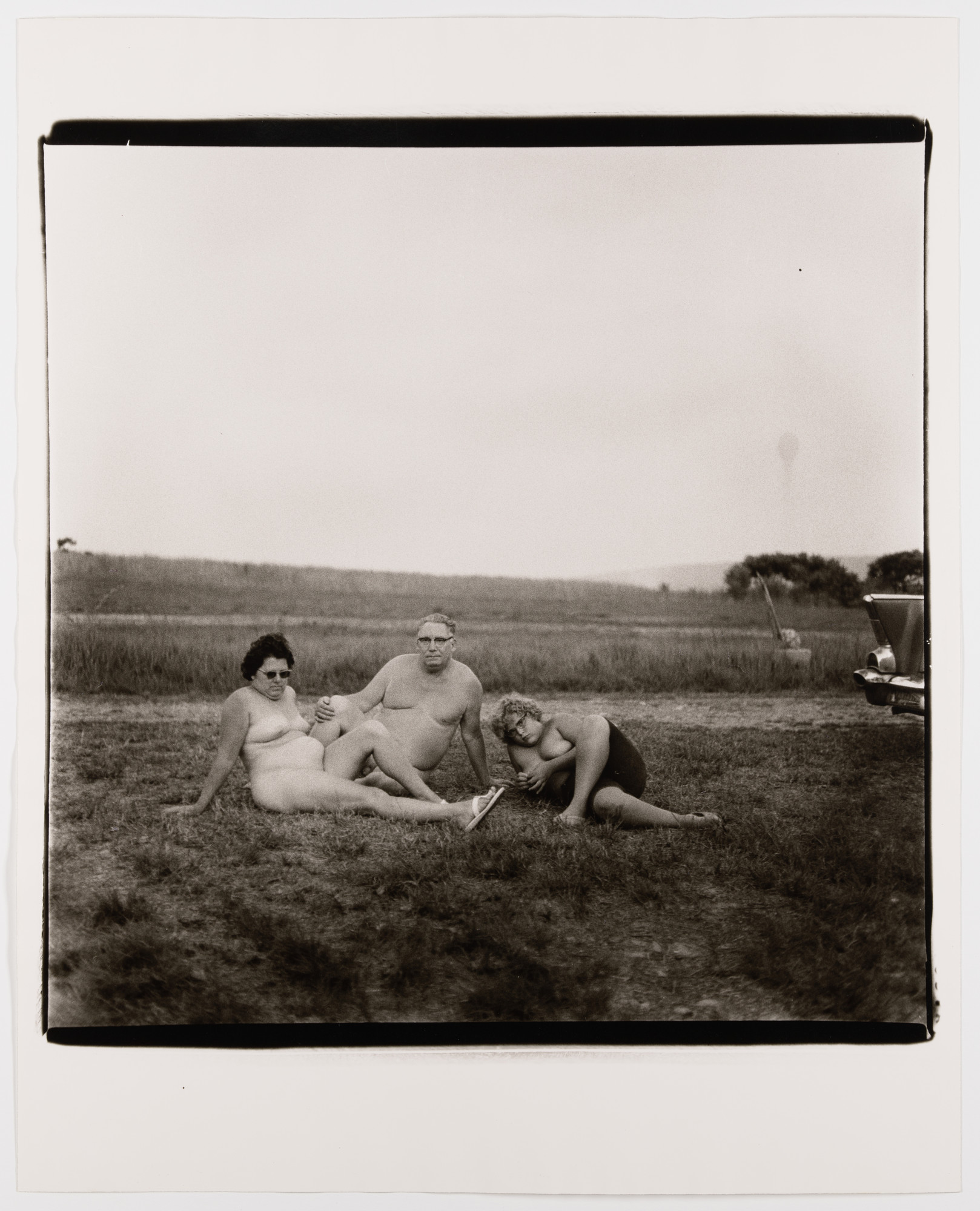 Diane Arbus. A family and their car in a nudist camp in P.A., 1965