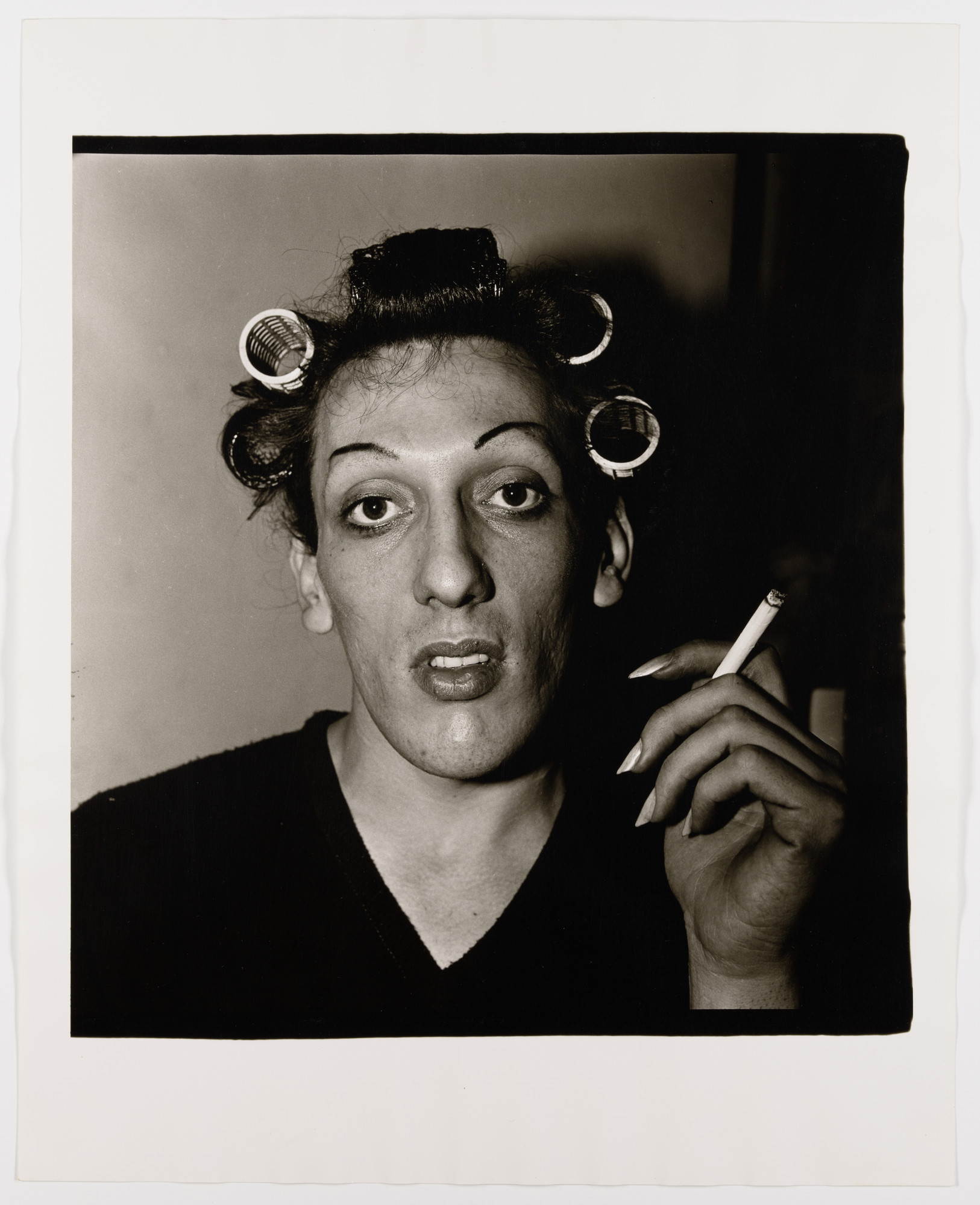 Diane Arbus. A young man in curlers at home on West 20th Street, N.Y.C.