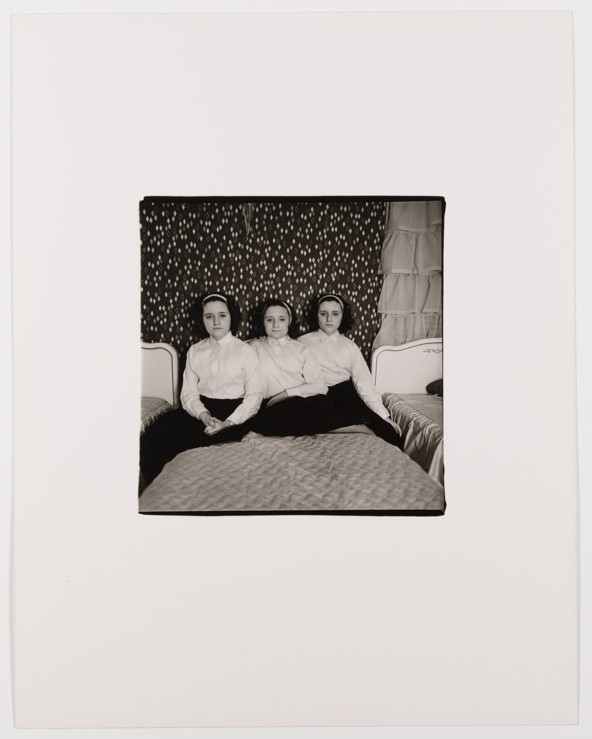 Diane Arbus. Triplets in their bedroom, N.J., 1963. 1963