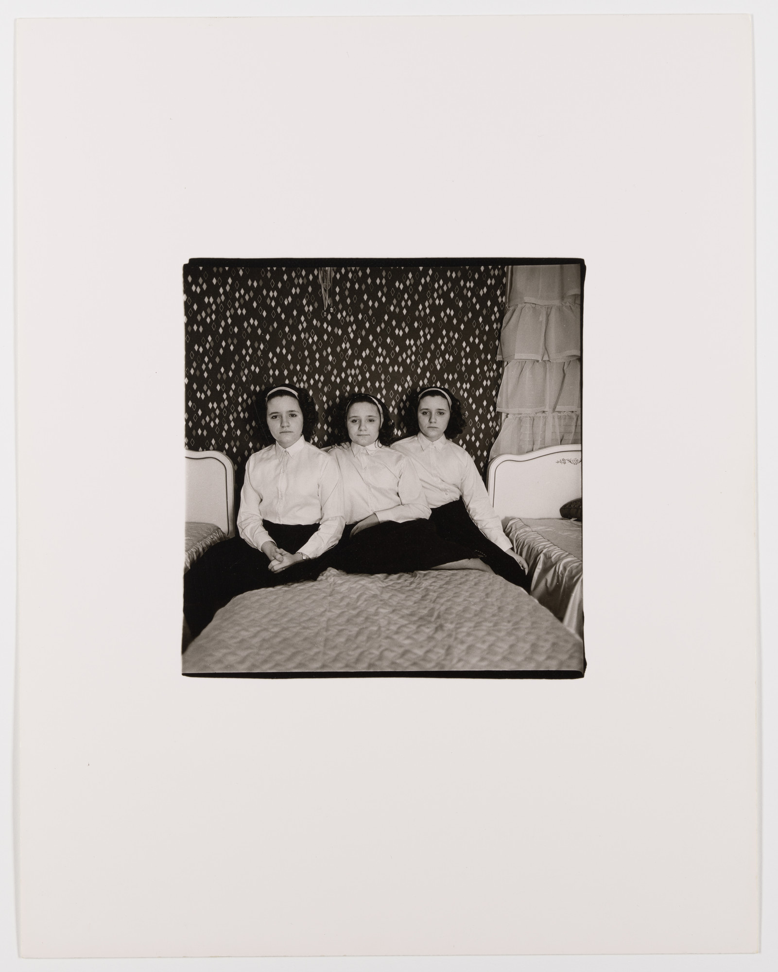 Diane Arbus. Triplets in their bedroom, N.J., 1963. 1963 | MoMA