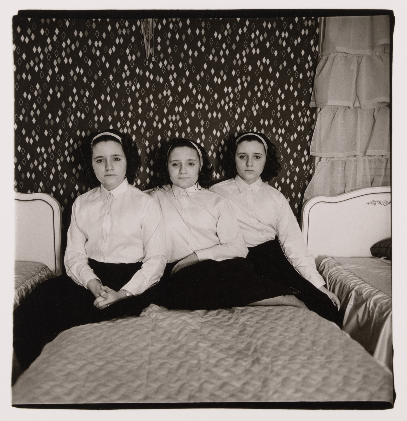 Diane Arbus. Triplets in their bedroom, N.J., 1963. 1963