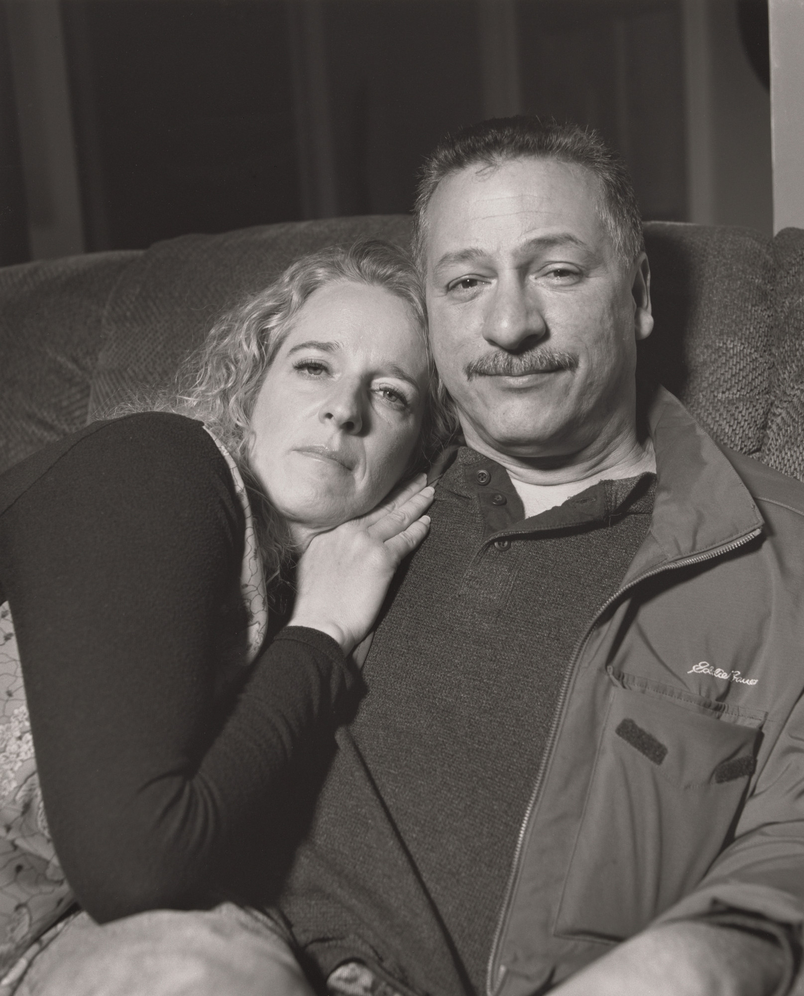 LaToya Ruby Frazier. Dave Lopez, UAW Local 1714, with his girlfriend Trisha Brown on her recliner, (25 years in at GM Lordstown Complex, electrician, skilled trades), Youngstown, OH.
