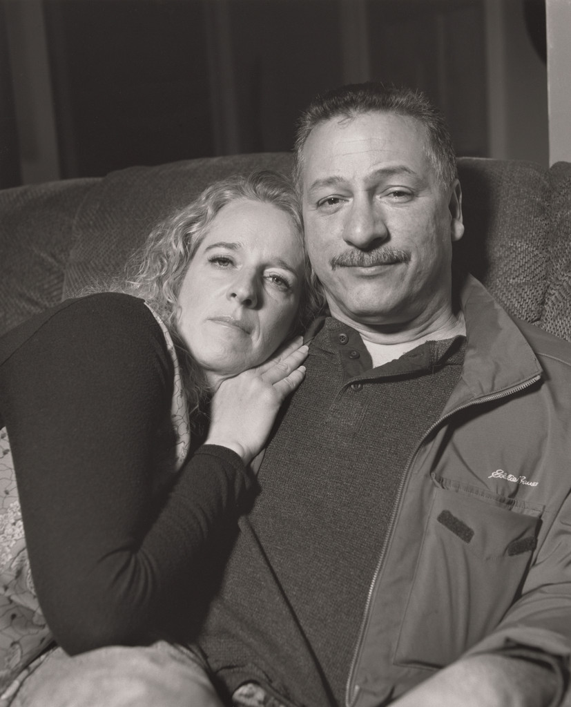 Dave Lopez, UAW Local 1714, with his girlfriend Trisha Brown on her recliner, (25 years in at GM Lordstown Complex, electrician, skilled trades), Youngstown, OH.