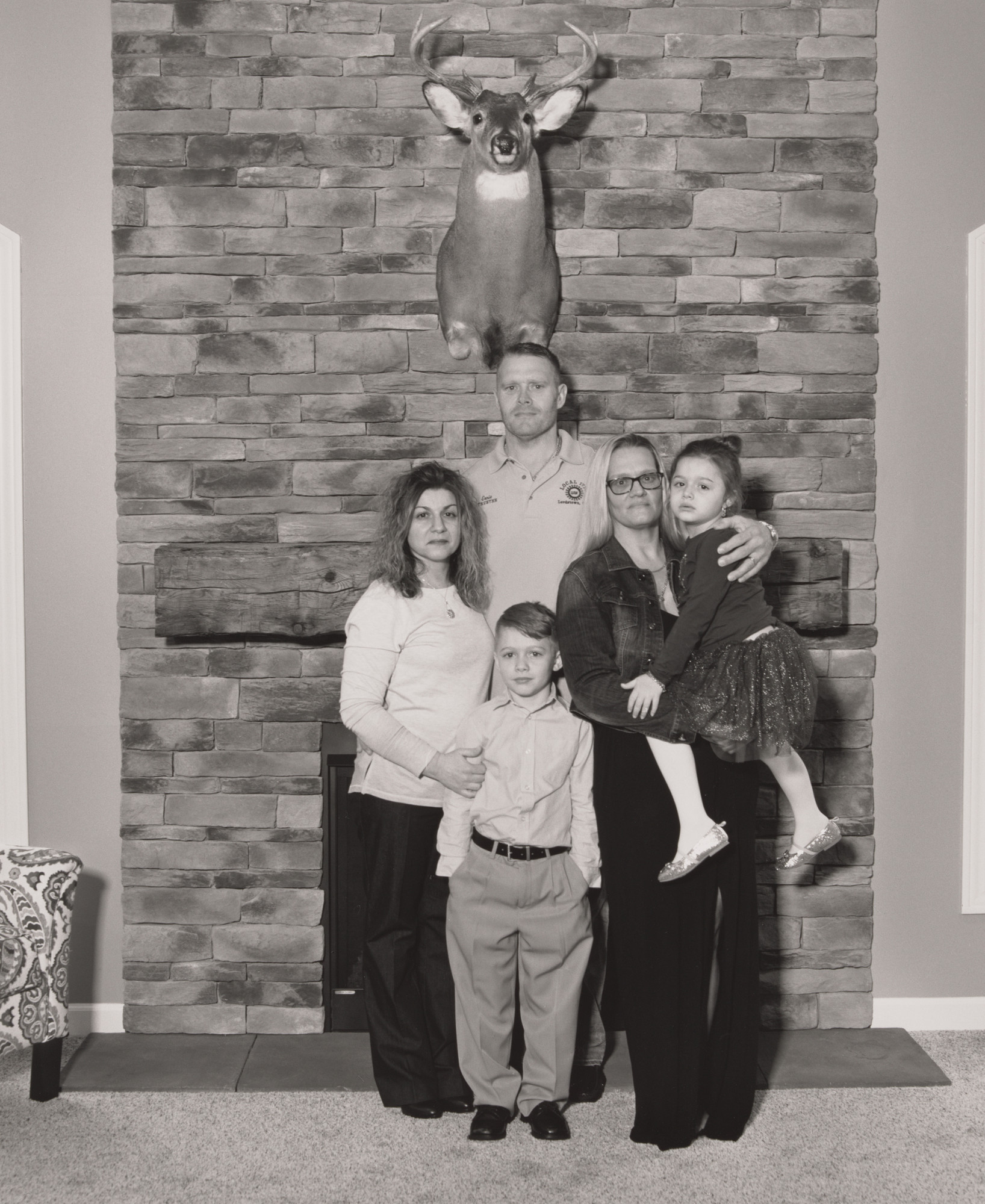 LaToya Ruby Frazier. Ernie Long, UAW Local 1714, Trustee, with his wife Eydokia, their children Christian and Mia, and his sister Brandie in front of his custom-designed fireplace, (11 years in at GM Lordstown Complex, press room team leader), Highland Township, OH.