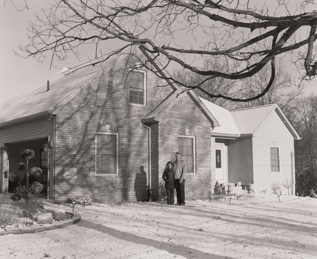 Ernie Long, UAW Local 1714, Trustee, (11 years in at GM Lordstown Complex, Press Room team leader), with his wife Eydokia standing in front of their newly custom-built house, Highland Township, OH, 2019, LaToya Ruby Frazier, 2019