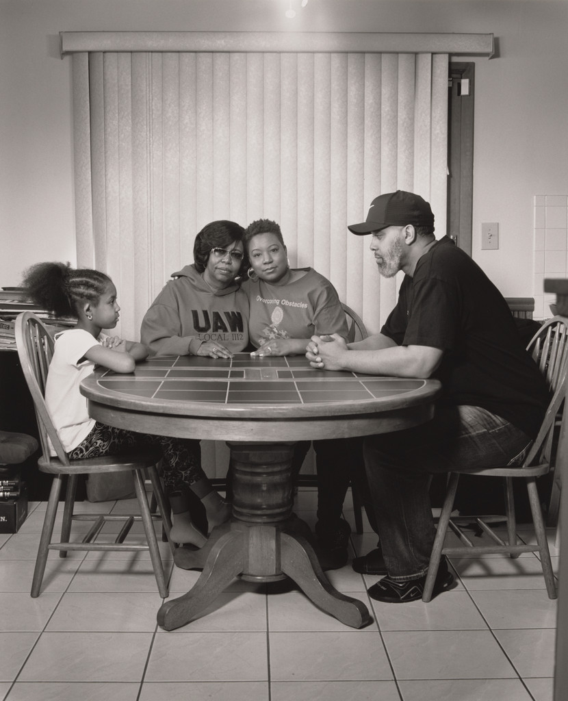 Sherria Duncan, UAW Local 1112, at her kitchen table with her mother Waldine Arrington, her daughter Olivia, and her husband Jason, (23 years in at GM Lordstown Complex, trim and paint shop),Waldine Arrington (34 years in at GM Lordstown Complex, van plant, car plant, body shop, chassis, everywhere except paint and trim), Austintown, OH.