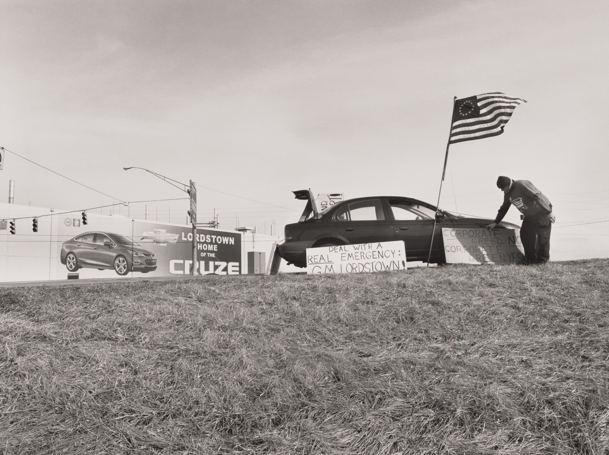 LaToya Ruby Frazier. Werner Lange, 45-day vigil, standing at the intersection of Ellsworth Bailey Road and I-80 Ohio Turnpike toll road entrance, Lordstown, OH, 2019