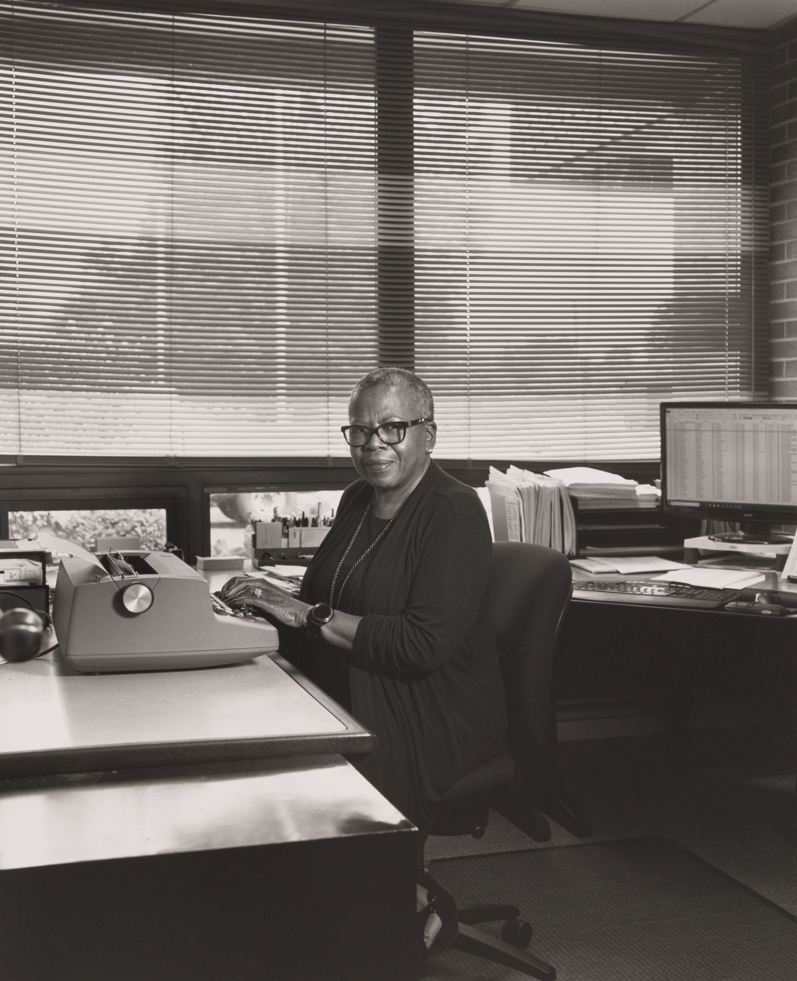 LaToya Ruby Frazier. Diane Franklin, Office and Professional Employees international Union (OPEIU), inside her office typing on her
IBM Selectric II typewriter at UAW Local 1112 Reuther Scandy Alli union hall, (48 years in as UAW Local 1112 secretary), Lordstown, OH.