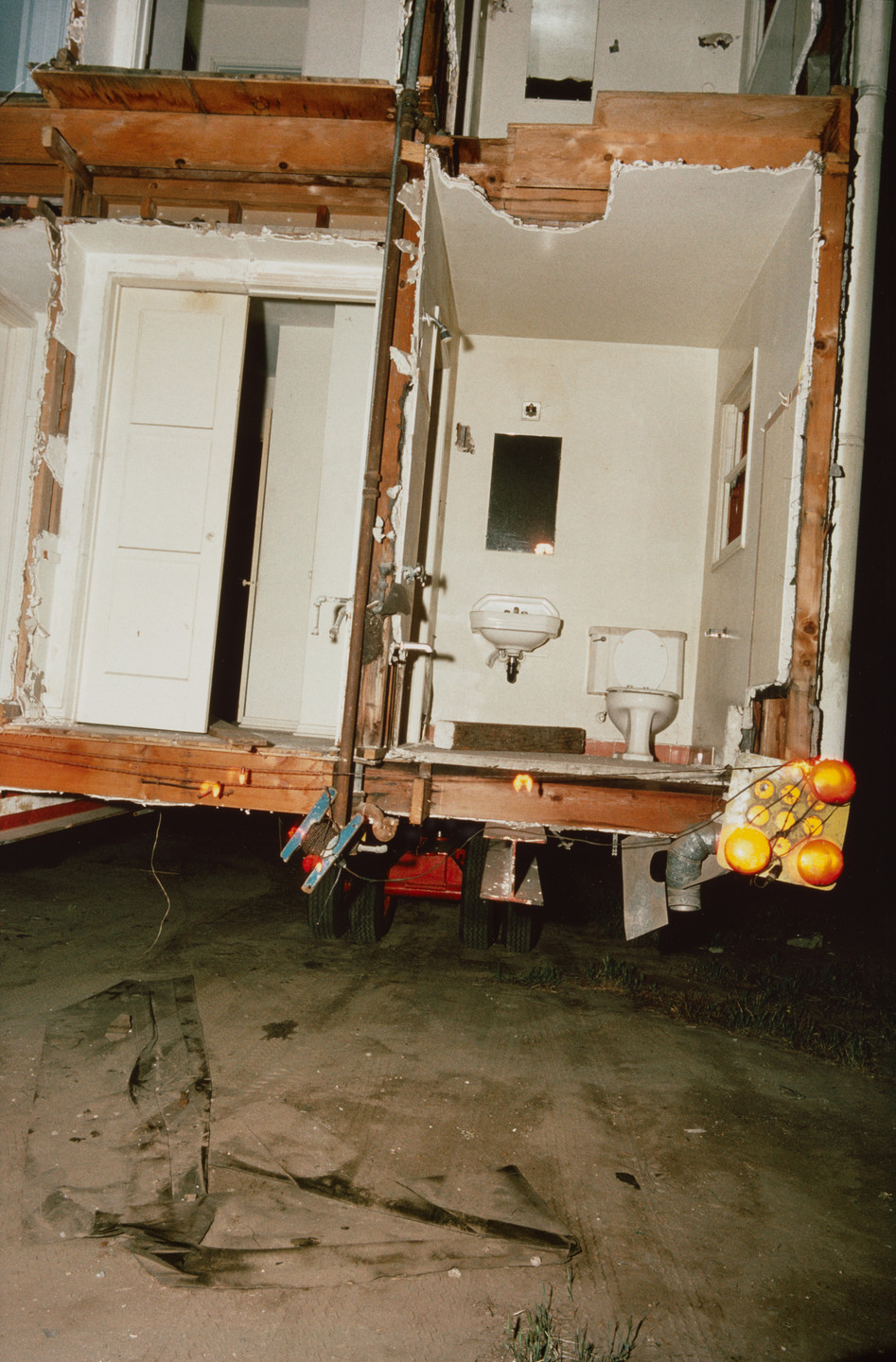 Allan Sekula. Shipyard-workers&#39; housing--built during the Second World War--being moved from San Pedro to South-Central Los Angeles from the series Fish Story. May 1990