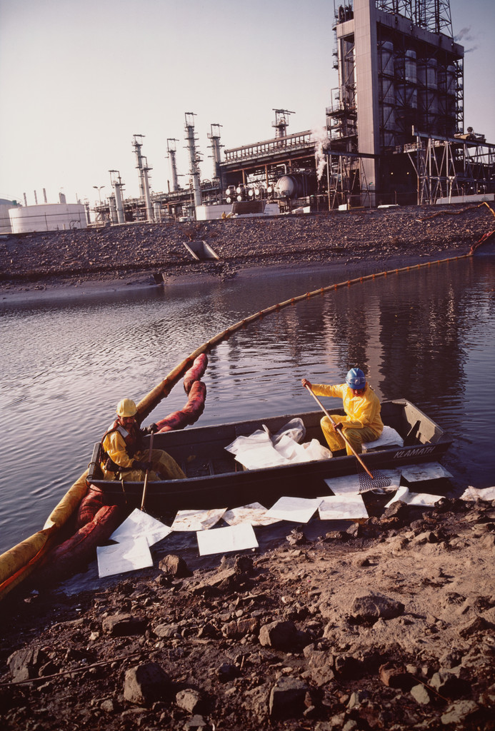 Workers cleaning up chemical spill after refinery explosion. Los Angeles harbor. Wilmington, California from the series Fish Story