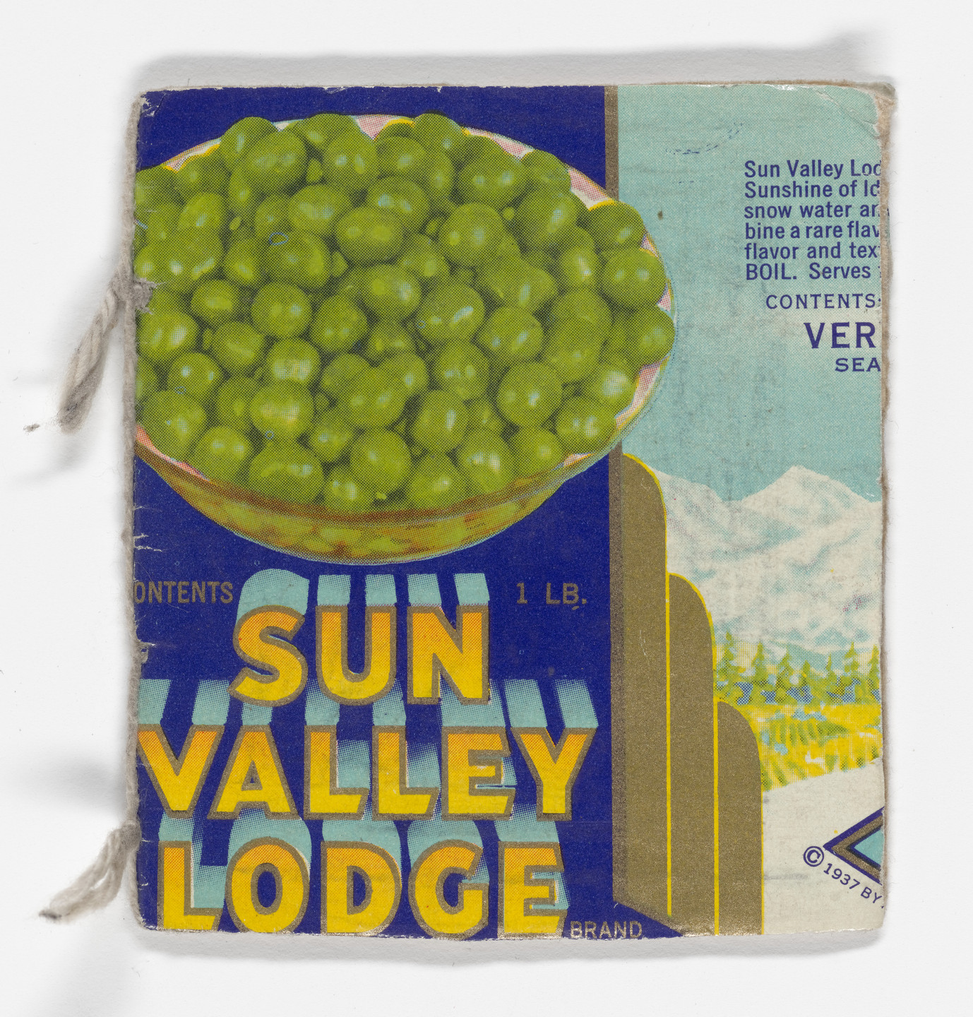 A blue label with &#34;Sun Valley Lodge&#34; in bold yellow letters features a bowl of green peas. The background has a mountainous landscape and text in the upper right corner, predominantly in light blue. This is an AI generated description. To give feedback, email ai@moma.org.