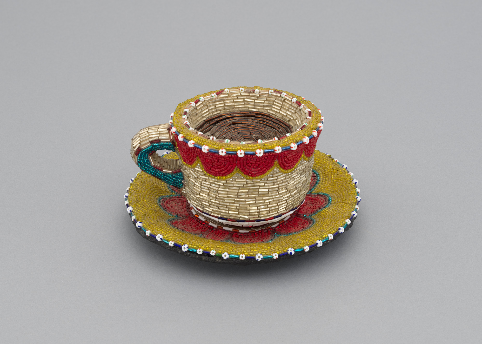 Liza Lou. Cup and Saucer. 1995
