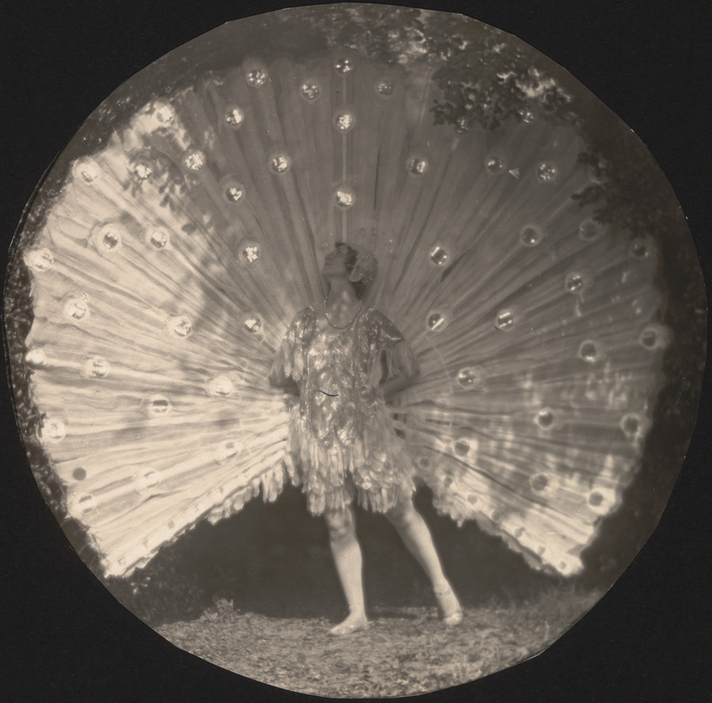 Violet Romer. (with peacock fan)