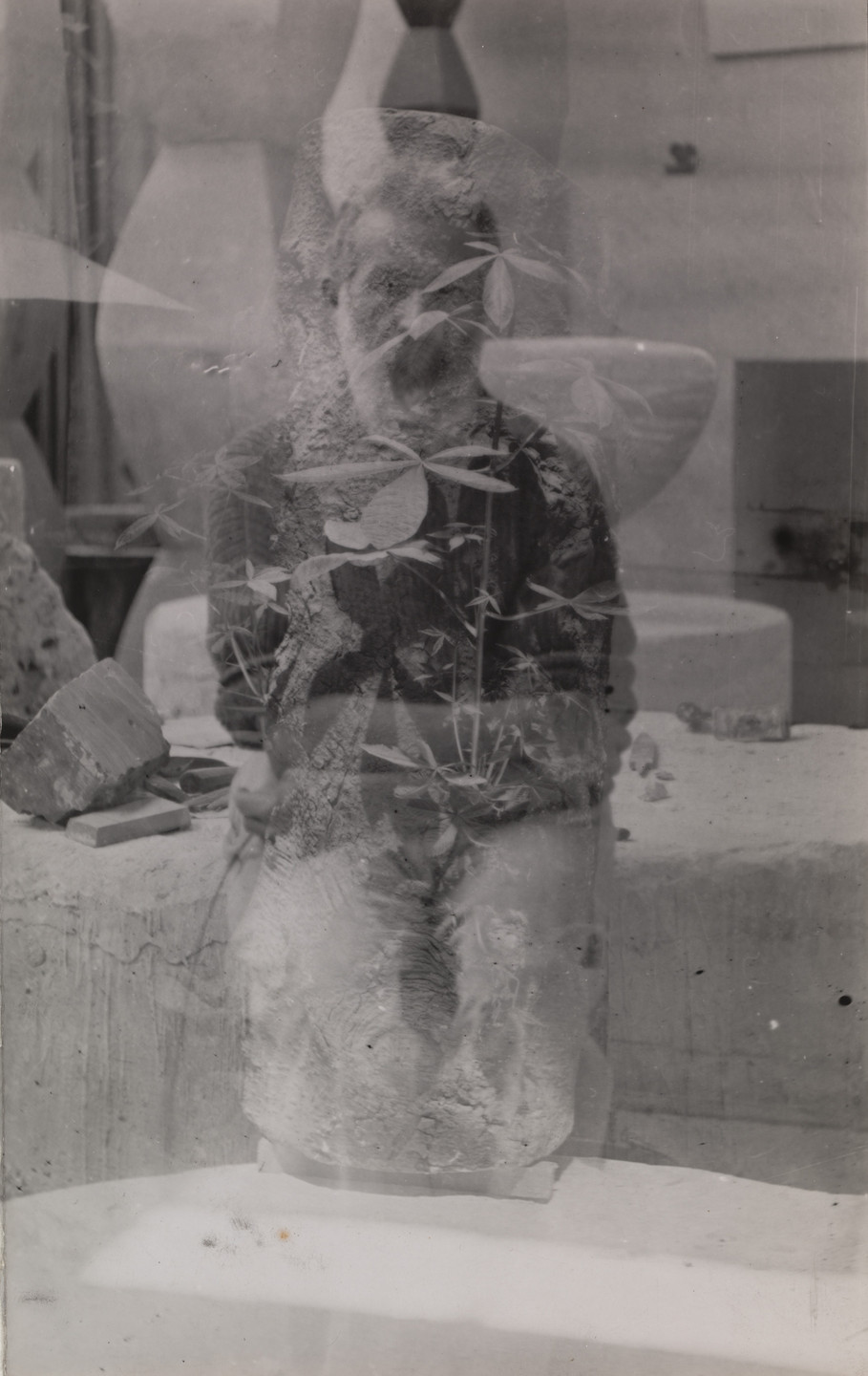 Constantin Brâncuși. Untitled (self-portrait in the studio with Endless Columns I, III, III and Fish). 1933-34