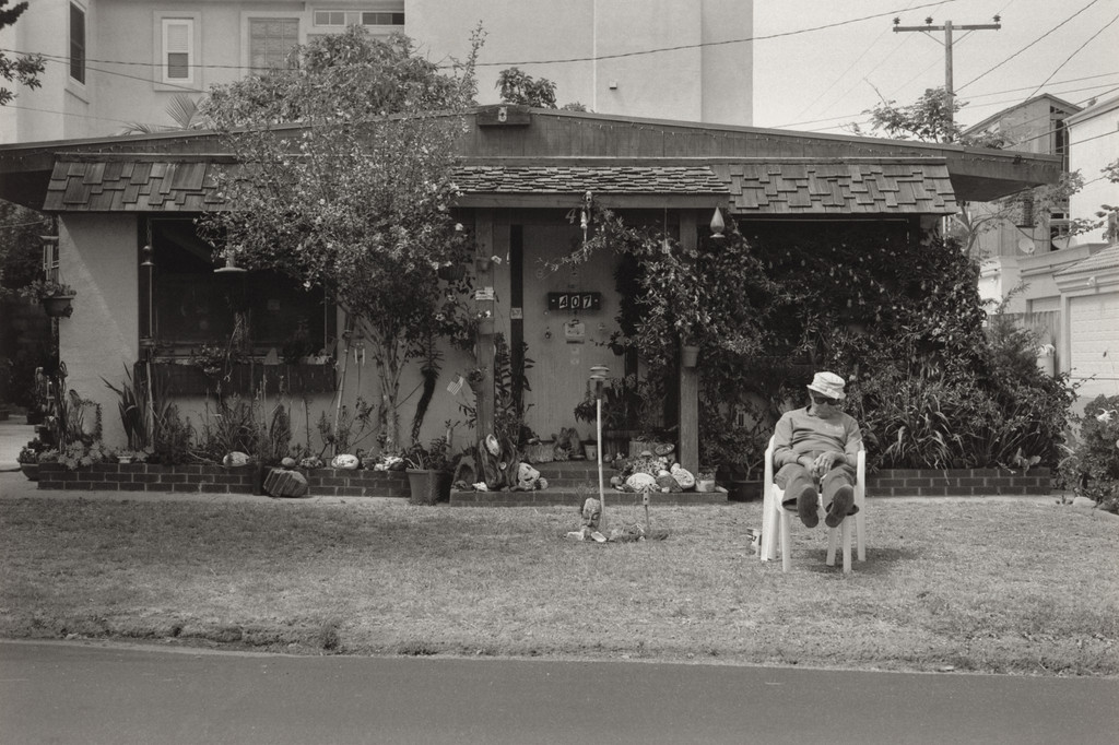 Huntington Beach (man asleep in front yard)