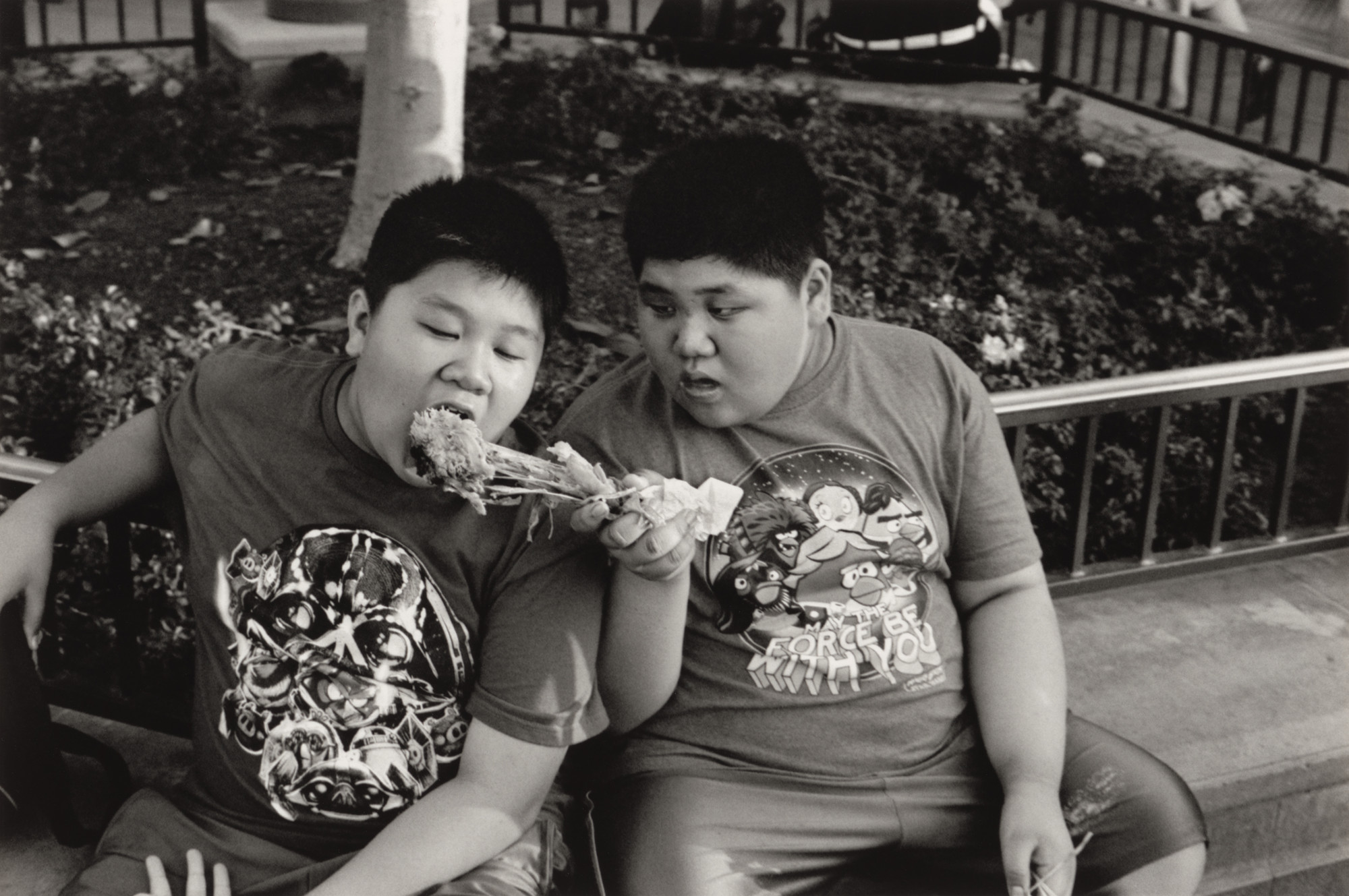 Ed Templeton, Deanna Templeton. Two boys eating, Disneyland. 2015