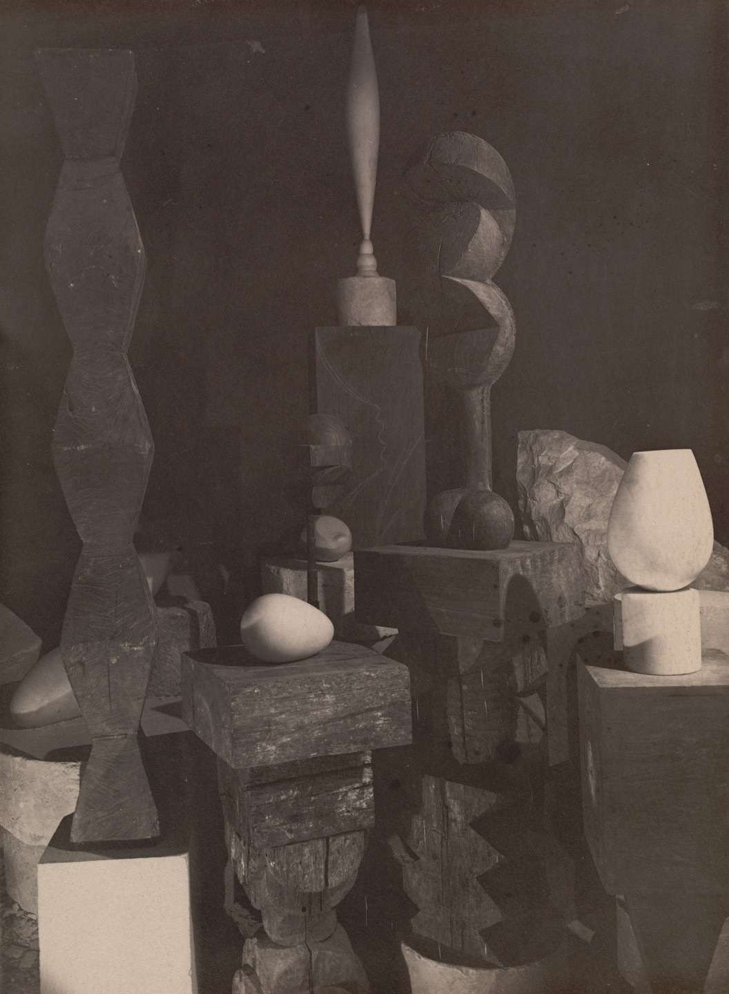 Constantin Brâncuși. Untitled (View of the Studio with Endless Column, Beginning of the World, Adam and Eve, Bird in Space, and Torso of a Young Girl). 1922
