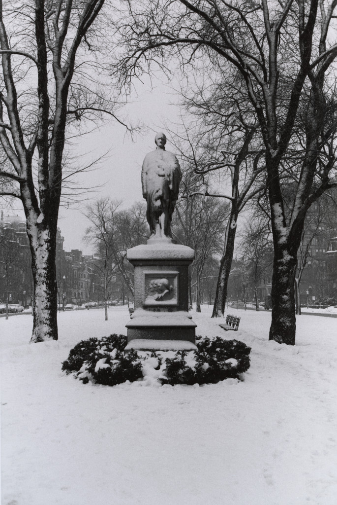 Boston (statue in snowy park, center)