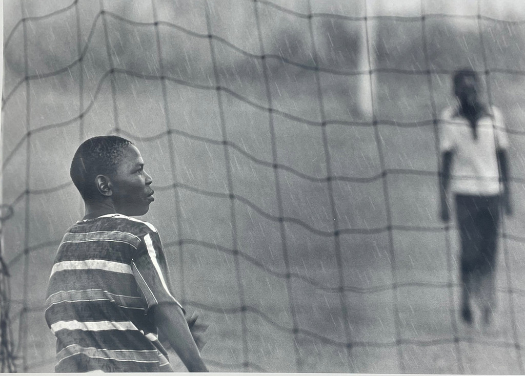 Soccer Players in the Rain, Soweto, South Africa