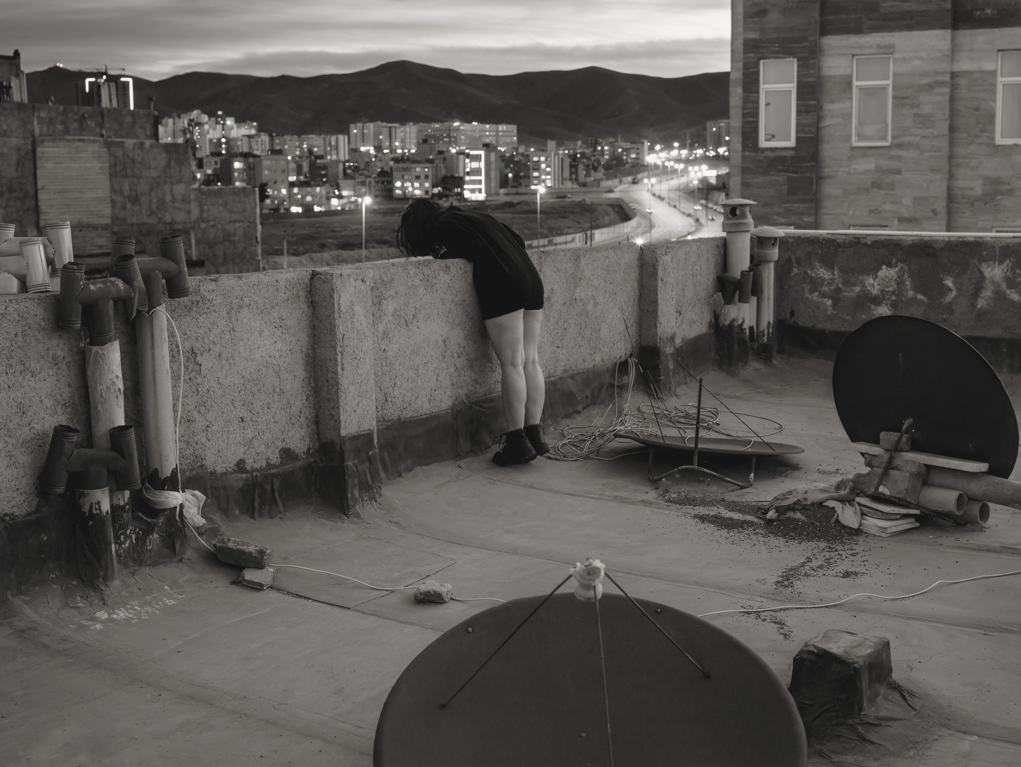 Sara Abbaspour. Untitled (girl looking down from rooftop)