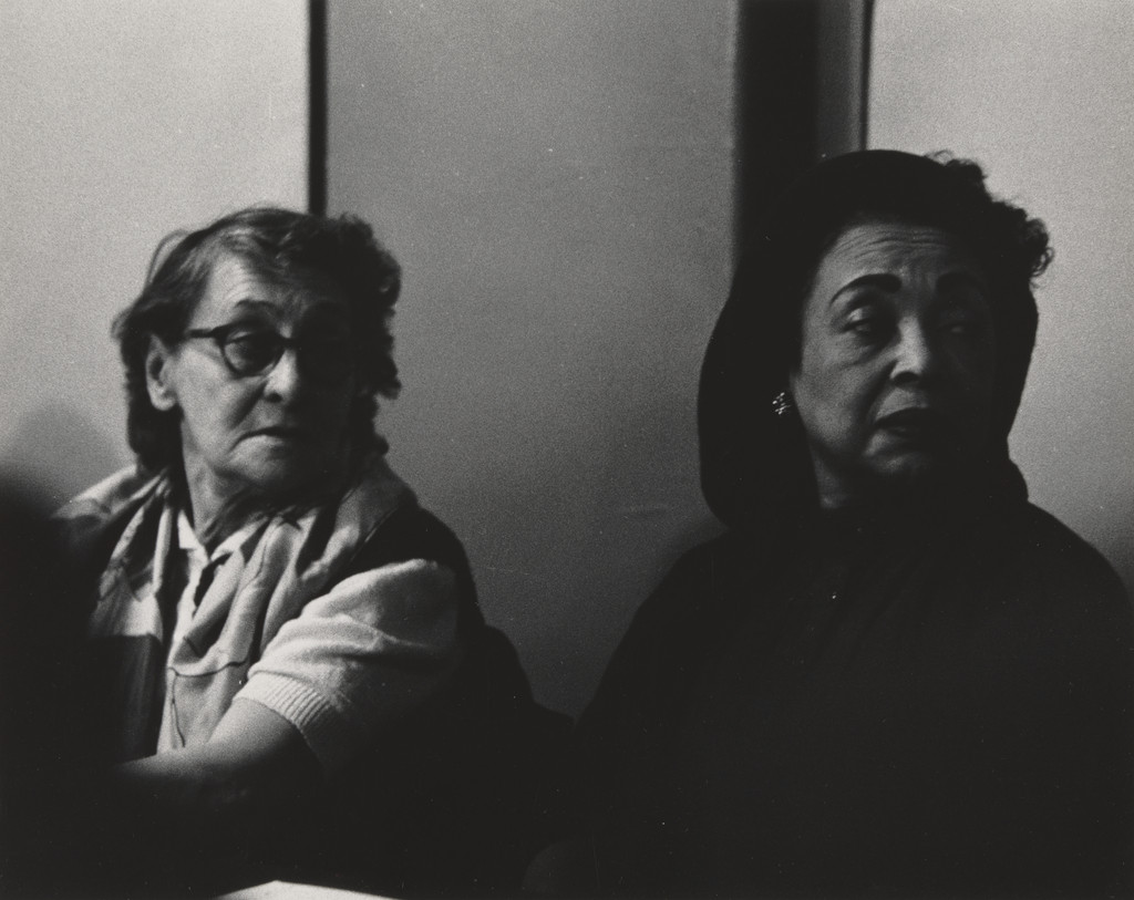 Untitled (two women looking over their shoulders)