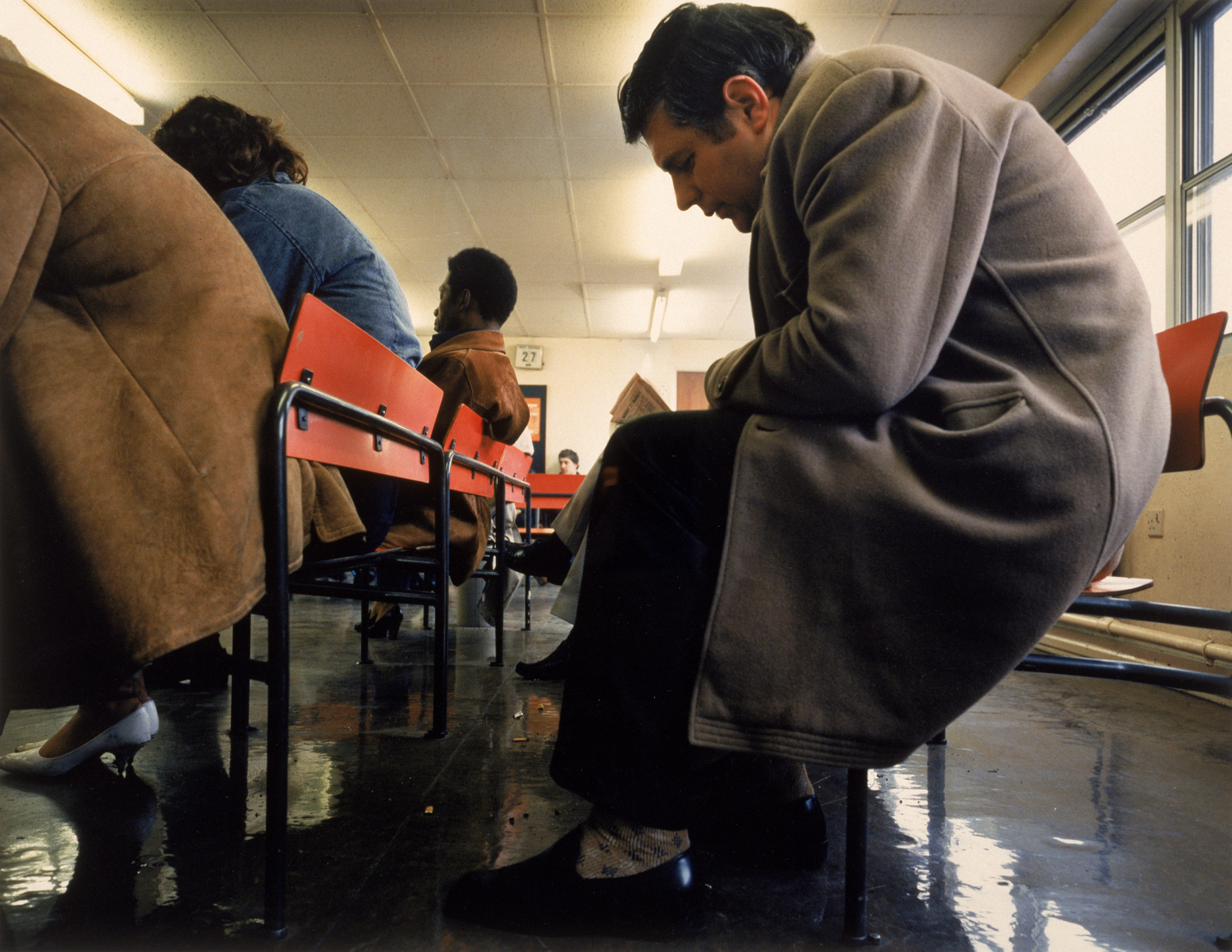 Paul Graham. Crouched Man, DHSS Waiting Room, Bristol. 1984