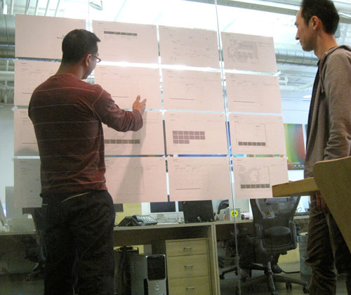 The team at Hello Design reviews the concept designs