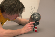 Chris Tichborne helps the Robot pump it up